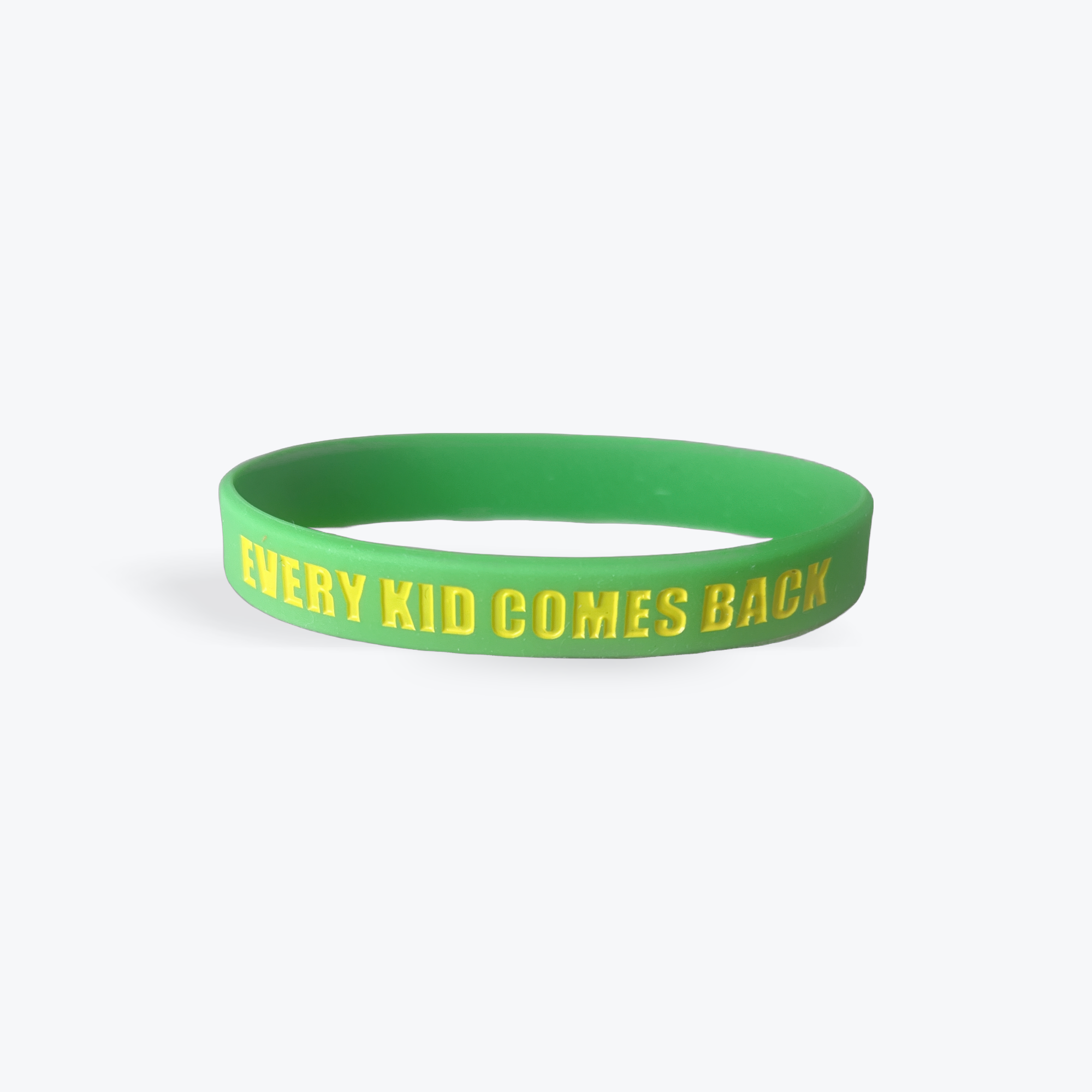 Every Kid Comes Back wristband — green silicone with gold embossed text